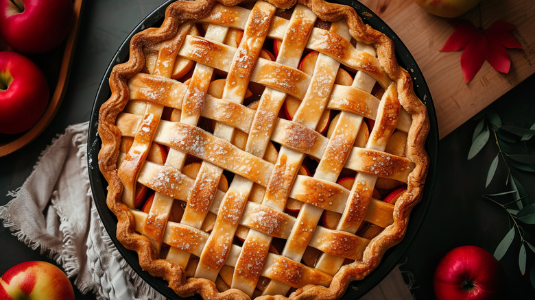 Apple pie next to apples