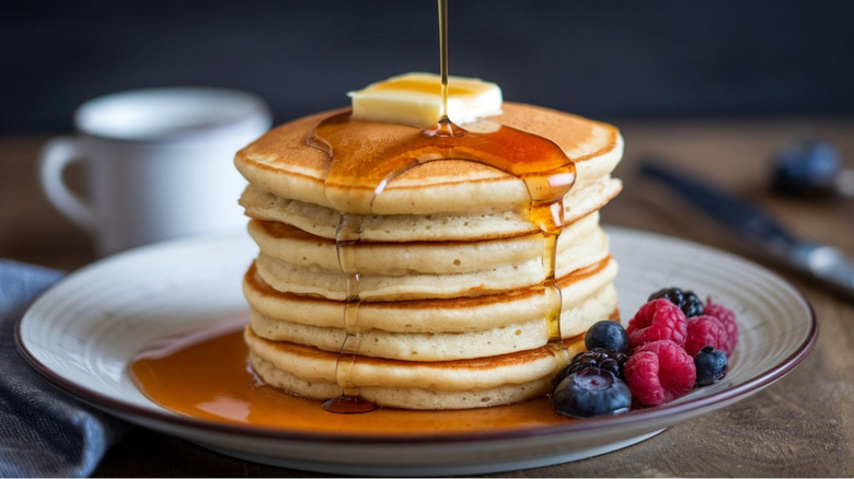 Stack of American thick pancakes with syrup