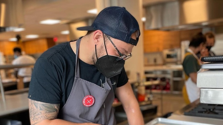 American Test Kitchen employee with union badge