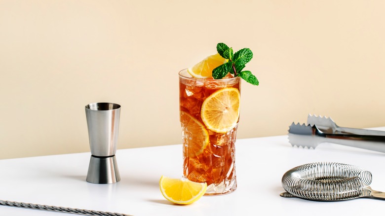 Long Island iced tea on table with barware