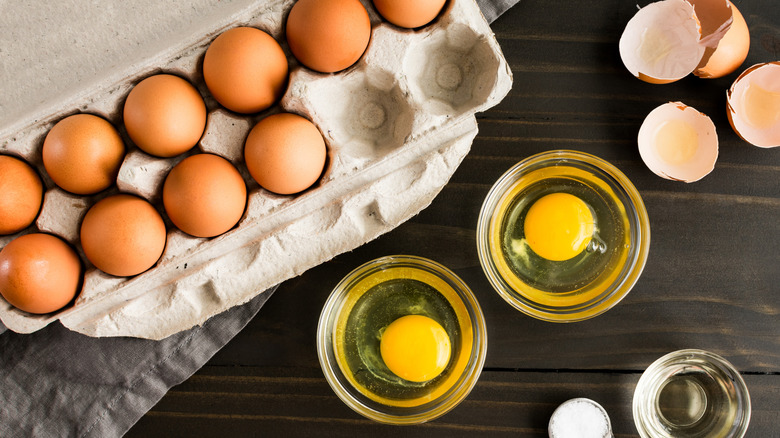 Cracked eggs in small containers