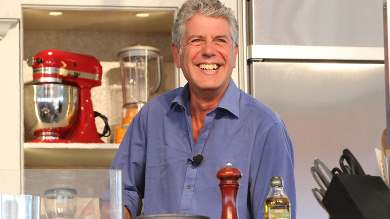 Anthony Bourdain smiles in test kitchen