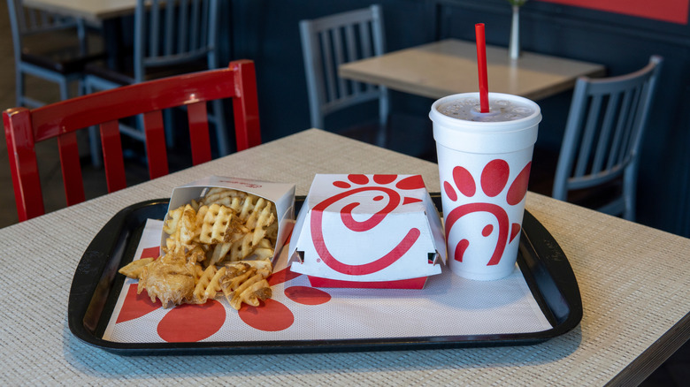 An order of Chick-fil-A food and fries sits on a tray