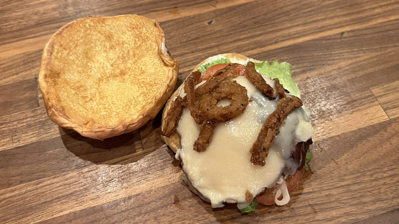 The Deep Fried Turkey Gobbler sandwich, open-faced on a wood table