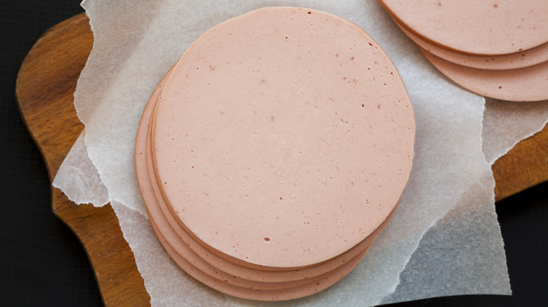 sliced bologna on cutting board