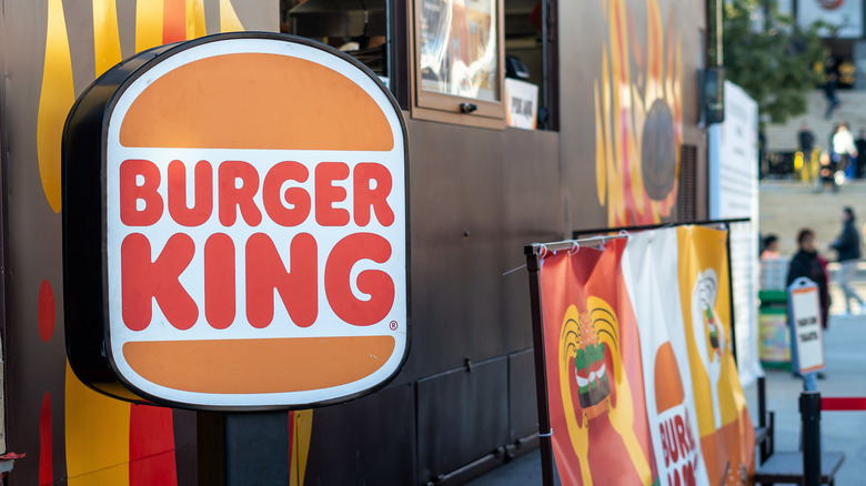 A Burger King sign outside of a restaurant