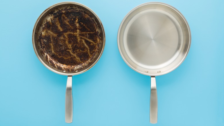 Damaged frying pan next to a new one