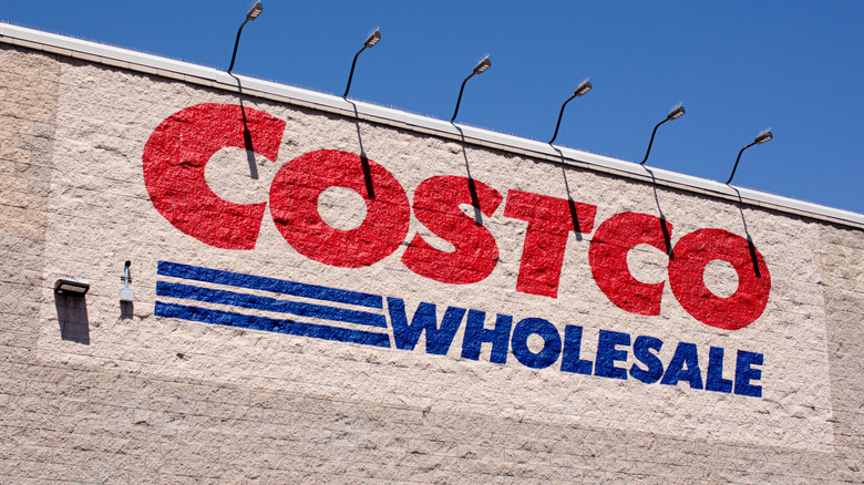 A Costco sign painted on a store.