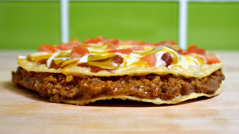 Taco Bell's Mexican pizza sitting on a table.