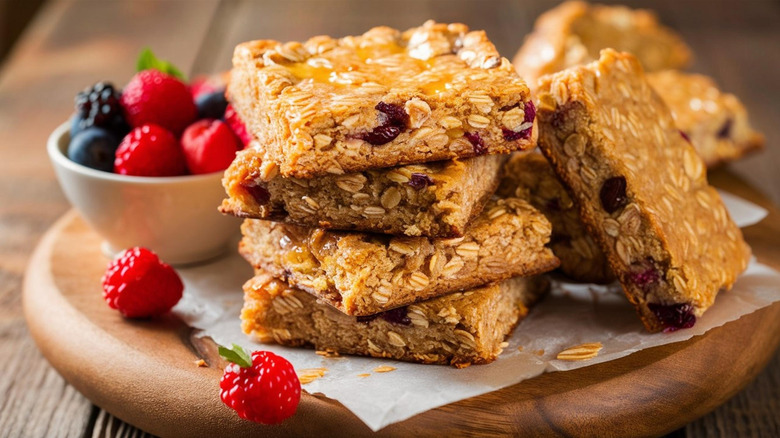 A pile of British flapjacks and some fresh berries