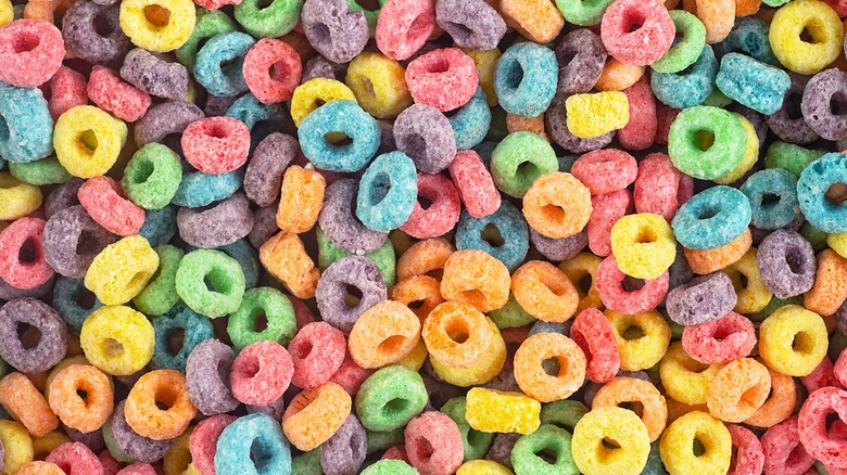 An image of Froot Loops cereal spread out on a counter.