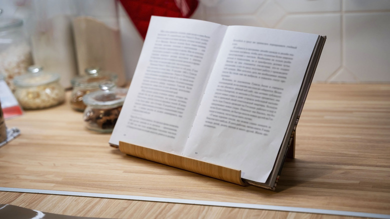 open recipe book on recipe stand on kitchen counter