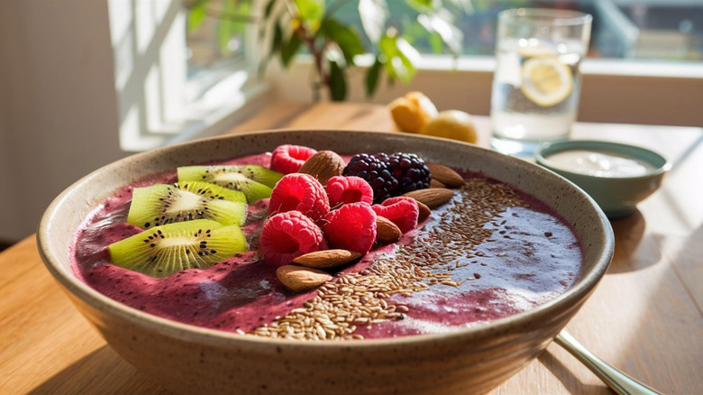 A bowl of oatmeal topped with superfoods like nuts, seeds, and berries