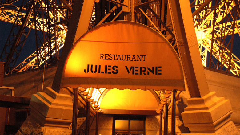 a view of Jules Verne restaurant entrance at night