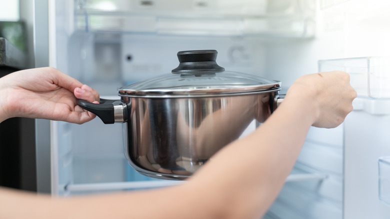 Pot going into a refrigerator