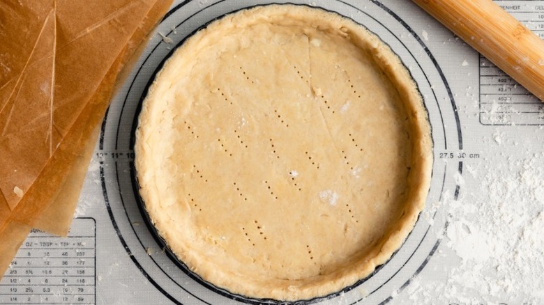 unbaked pie crust on oven