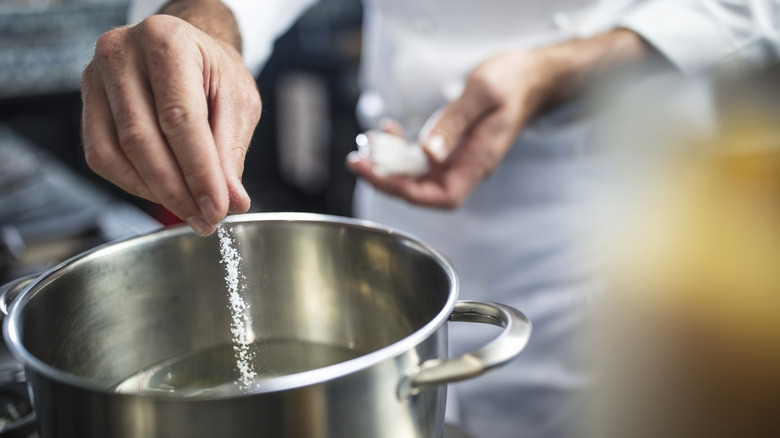 Adding salt to a pot