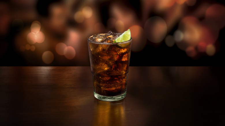 rum and coke with black background