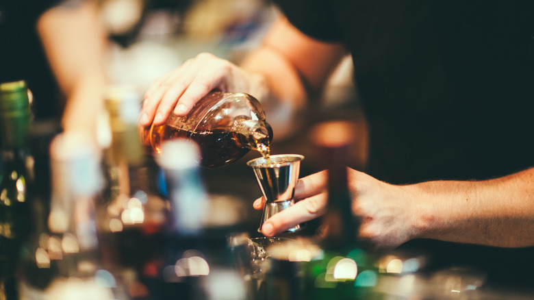 shot being poured at a bar