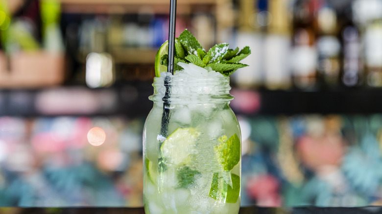 vibrant mojito with bar background