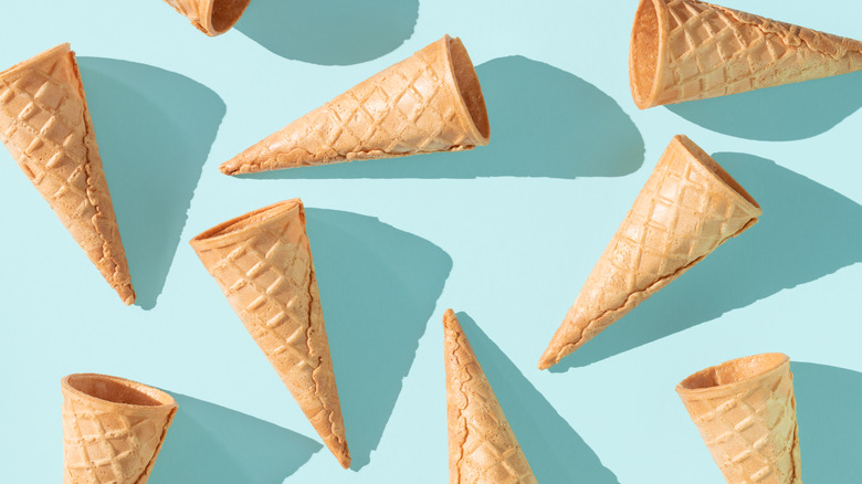 Waffle ice cream cones on light blue background