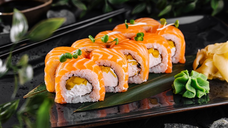 Salmon sushi roll with wasabi