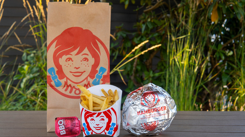 Foil-wrapped burger and fries from Wendy's