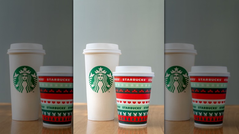 Two different sized Starbucks cups