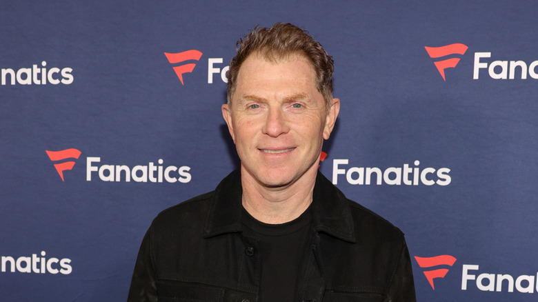 Bobby Flay smiling at a Fanatics event