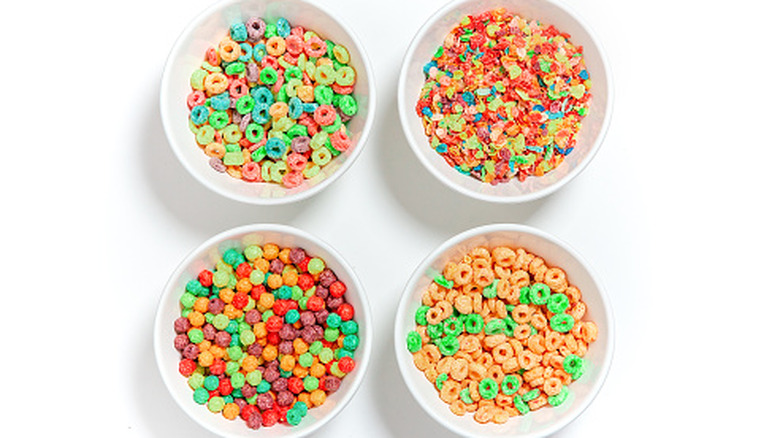 four sugary cereals in bowls