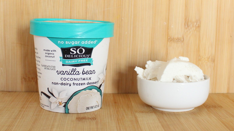 Container and bowl of So Delicious vanilla frozen dessert