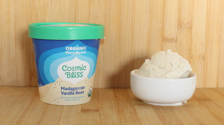 Container and bowl of Cosmic Bliss vanilla frozen dessert