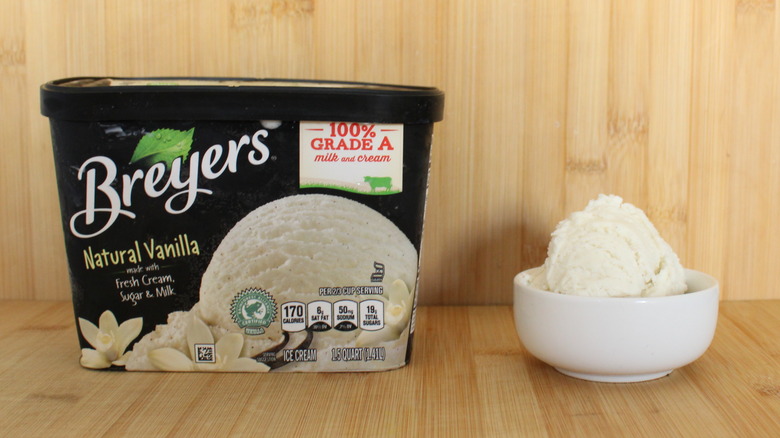 Container and bowl of Breyer's vanilla ice cream