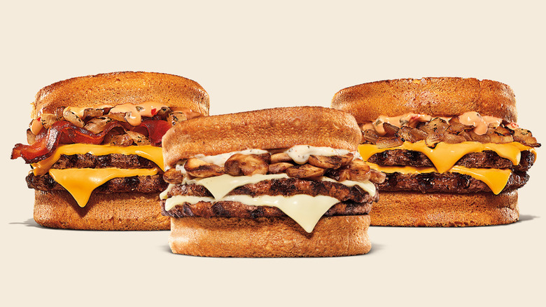 Three different Burger King Melts face the camera straight on