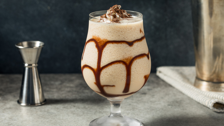 A mudslide with chocolate syrup and shavings