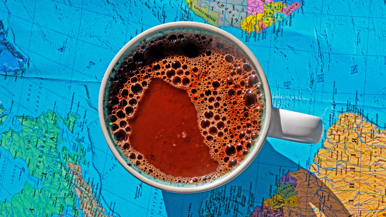 Cup of hot cacao on world map