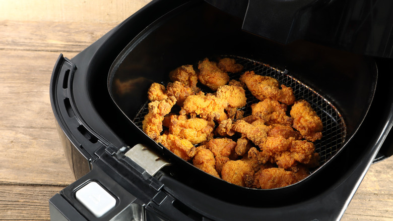 Popcorn chicken pieces in an air fryer