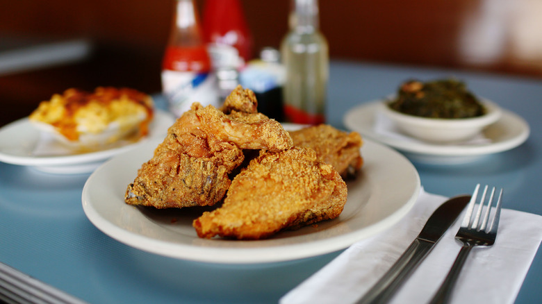 Pieces of fried chicken on a plate.