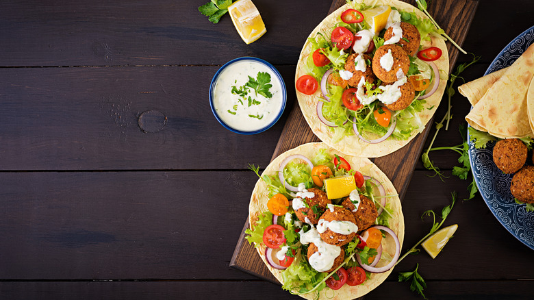 Falafels and vegetables in flour tortillas