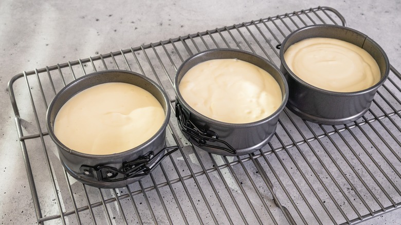 mini cheesecakes on a cooling rack