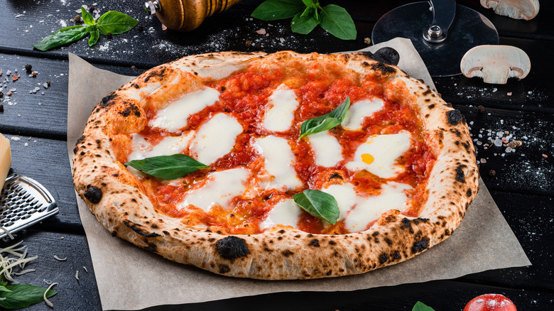 Neapolitan style pizza with tomato sauce, mozzarella, and basil