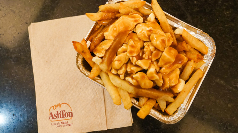 Poutine in metal pan on Chez Ashton napkin