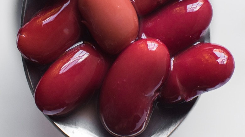 Close-up of red beans on spoon