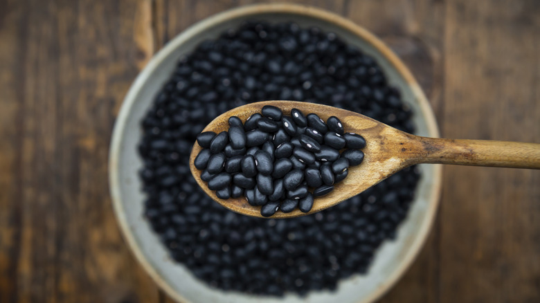 Wooden spoonful of black beans