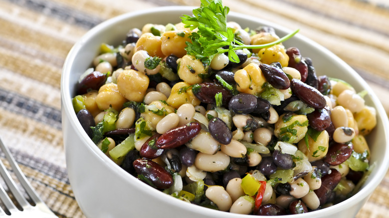 White bowl filled with a variety of beans