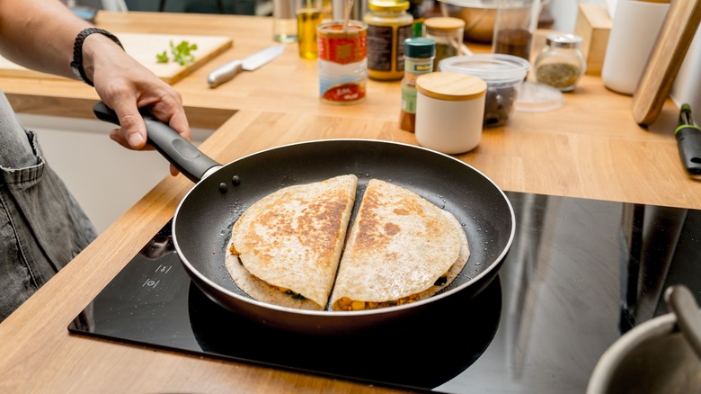 Two quesadillas in a skillet