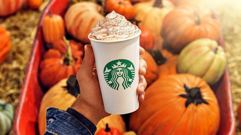 Handheld pumpkin spice latte at Starbucks