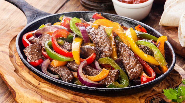 Beef fajitas with peppers in a skillet