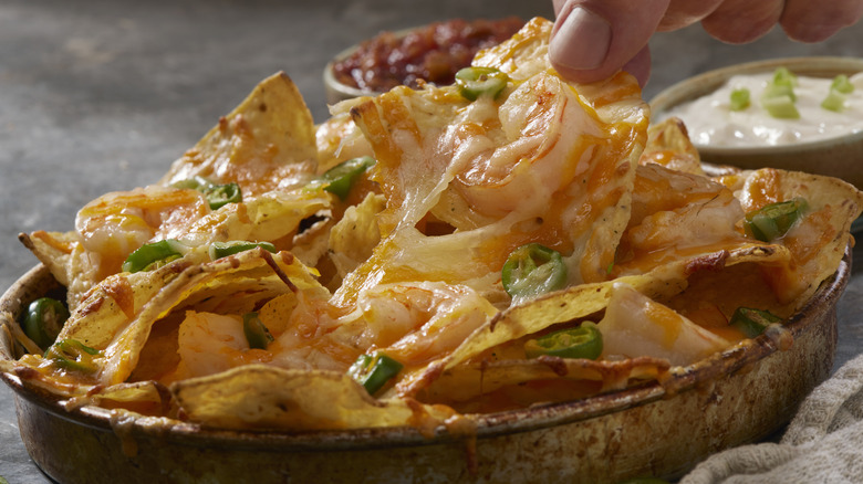 Nachos topped with shrimp