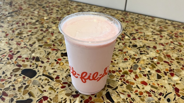 Pineapple Dragonfruit Frosted Lemonade sits on a counter.